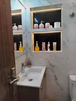 a bathroom with a sink and a mirror at appartement Jalal in Marrakech