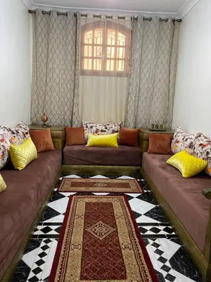 a living room with a couch and a rug at Garden View Comfort Apartment in Marrakech