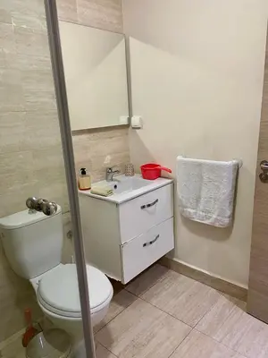 a bathroom with a toilet and a sink and a mirror at studio design prestigia jad in Marrakech