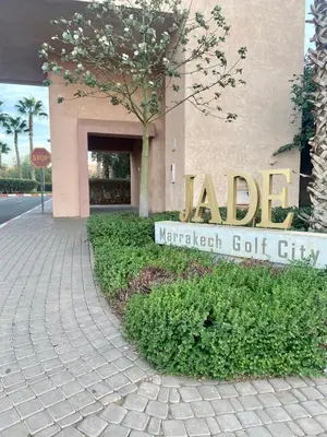 a sign in front of a marriott golf city at studio design prestigia jad in Marrakech