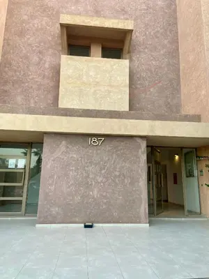 a building with a sign on the side of it at studio design prestigia jad in Marrakech