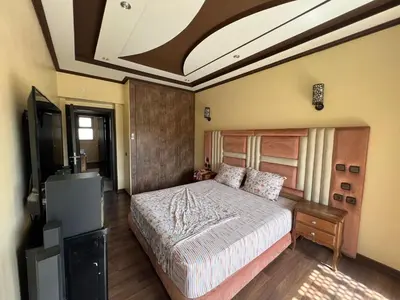 a bedroom with a large bed in a room at Villa zinaya in Marrakech