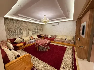 a living room with a couch and a table at حدائق حي شريفية بوعكاز مراكش in Marrakech