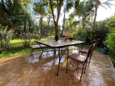 a table and chairs sitting on a patio at Riad Wael in Marrakech