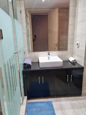 a bathroom with a sink and a mirror at marrakech village in Marrakech
