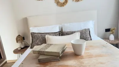 a bedroom with a bed with a wooden table at Calm Cozy Blue Loft Modern Stay in Marrakech