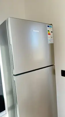 a stainless steel refrigerator in a kitchen at Calm Cozy Blue Loft Modern Stay in Marrakech