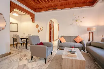 a living room with a couch and chairs and a table at Marrakech Palmeraie 2, 2-bedroom appartment, G1 , swimming pool residence, in Marrakech