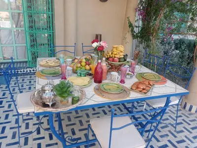 a blue table with food on top of it at Bluegreen Guest House Marrakech in Aït Amara