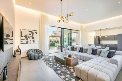 a living room with a couch and a table at Prestige Twin Villa with Splendid View in Marrakech