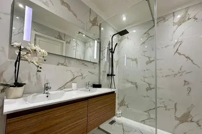 a bathroom with a sink and a shower at Atlas Golf Resort with Terrace and Pools in Marrakech