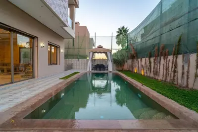 a swimming pool in the middle of a building at Luxury villa with heated pool and private Hammam in Marrakech