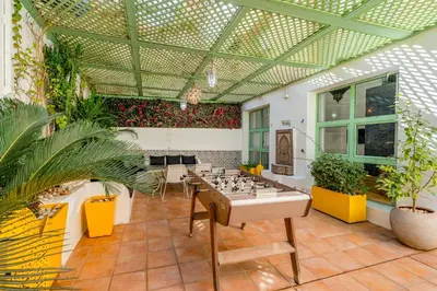 a large room with a chess game in the middle at Majorelle Place in Marrakech