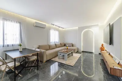 a living room with a couch and a table at Appartement au cœur de Guéliz in Marrakech