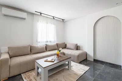 a living room with a couch and a coffee table at Appartement au cœur de Guéliz in Marrakech