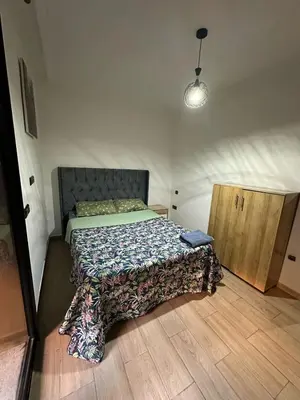 a bedroom with a bed with a quilt on it at Apartments city center in Marrakech