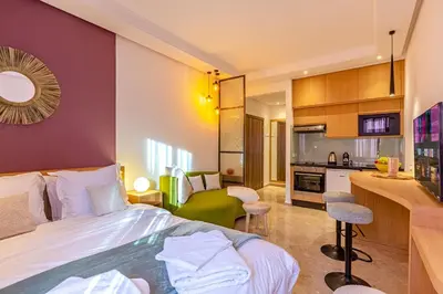 a hotel room with a bed and a kitchen at Central 1BR Studio- AC & IpTV-Self check in- 2 guests in Marrakech