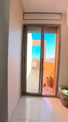 a room with a sliding glass door with a view at דירה