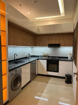 a kitchen with a stove and a dishwasher at Luxury apartment - Quiet and family-friendly neighborhood in Marrakech