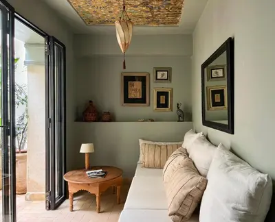 a living room with a couch and a table at Riad Dar Bou Seta - Small Riad in Marrakech