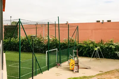 a batting cage on a tennis court at Noria Marrakech in Marrakech