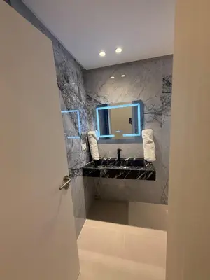a bathroom with a sink and a mirror at Modern Apartment in Jnane Gueliz in Marrakech
