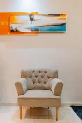 a couch in a room with a painting on the wall at Central Luxury Gem marrakech 3BR in Marrakech