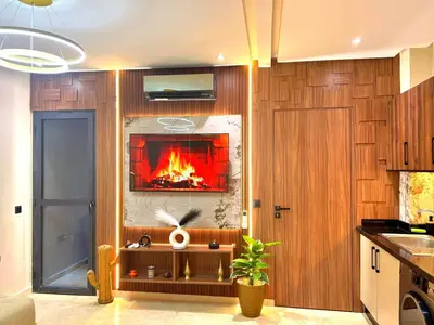 a living room with a fireplace in the wall at Central Victor Hugo Studio near Gueliz Wi-Fi in Marrakech
