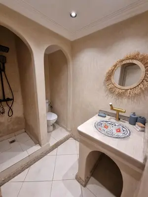 a bathroom with a sink and a mirror on the wall at BOHO Marrakech Medina in Marrakech