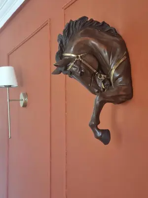 a bronze horse head is attached to a door at BOHO Marrakech Medina in Marrakech