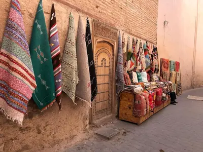 a store with a bunch of ties hanging on a wall at Dar Aji, votre maison d'architecte privatisée en médina in Marrakech