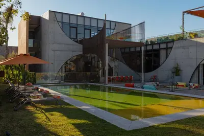 a house with a swimming pool in front of it at Villa Marrakech, Piscine Privée, Sauna et Gym in Marrakech