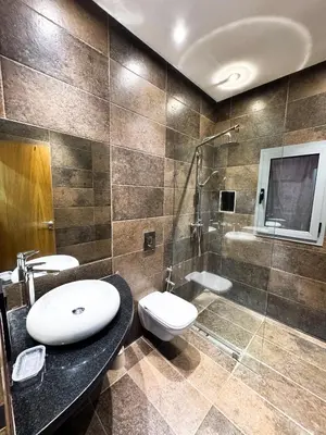 a bathroom with a sink and a toilet and a shower at Villa de luxe, à 20 minutes de Jamaa El Fna in Marrakech