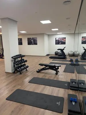 a gym with a lot of pilates equipment at Séjour Premium - Piscine, Jacuzzi, Chauffé et Salle de sport in Marrakech
