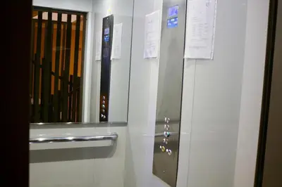 a locker room with a baseball bat and a mirror at Red nelbrj appartement in Marrakech