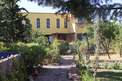 a house with a garden in front of it at Fawakay Villas in Sfiani