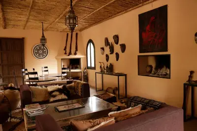 a living room with a couch and a table at Fawakay Villas in Sfiani