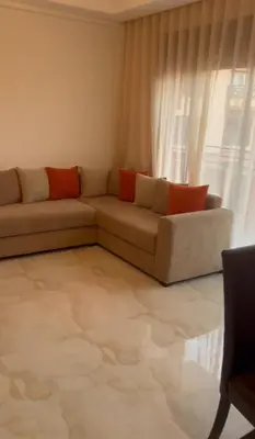 a living room with a couch and a window at appartement Marrakech in Marrakech