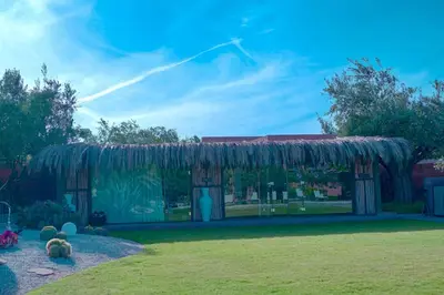 a house with some animals in a yard at Royal Palm Luxury Villa Heated Pool Spa in Moussiha