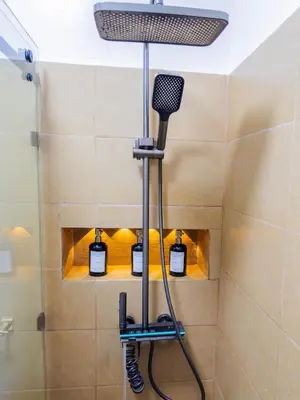 a shower room with a blow dryer in a bathroom at Cozy Apt Close to Gueliz & Medina in Marrakech