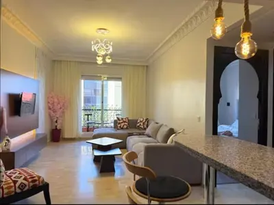 a living room with a couch and a table at Maison LINA in Marrakech