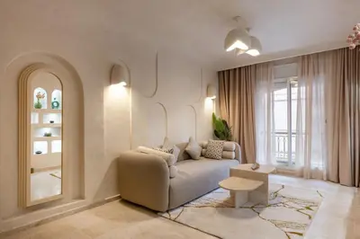 a living room with a couch and a window at Cosy escape 1BED in central Gueliz With Pool in Marrakech