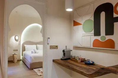 a bedroom with a bed and an arched doorway at City Center 1 BED Apartments - Miramas - Pool and gym in Marrakech