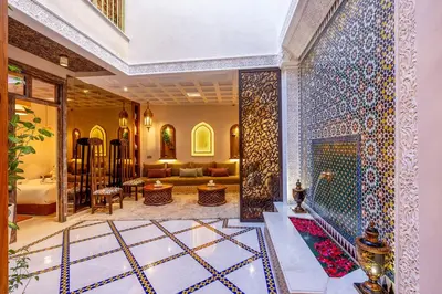 a living room with a persian tile wall at Riad Janate BAHIA & Spa in Marrakech