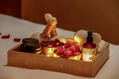 a wooden box with raspberries and a bottle of sauce at Riad Janate BAHIA & Spa in Marrakech