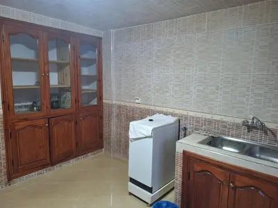 a kitchen with a sink and a refrigerator at charming place in Marrakech