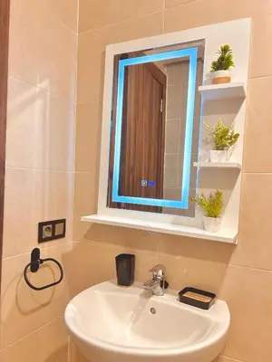 a bathroom with a sink and a mirror at Appartement Chic près M Avenue Piscine Balcon in Marrakech