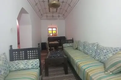 a living room with a couch and a piano at Madam Laila house in Marrakesh in Marrakech