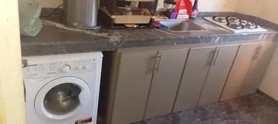 a kitchen with a washing machine and a sink at Belkadi in Marrakech
