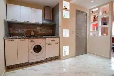 a laundry room with a washer and dryer at Victor Hugo Prestige Suite in Marrakech